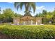 The community entrance welcomes you with a fountain and lush landscaping at 3064 Yellow Lantana Ln, Kissimmee, FL 34747