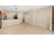 Bright living room with tile flooring and stairs to the upper level at 3064 Yellow Lantana Ln, Kissimmee, FL 34747