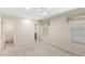 Spacious main bedroom featuring neutral walls, carpet flooring, large window and a walk-in closet at 3064 Yellow Lantana Ln, Kissimmee, FL 34747