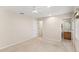 Large bedroom with neutral walls, carpet, a ceiling fan and access to the ensuite bathroom at 3064 Yellow Lantana Ln, Kissimmee, FL 34747