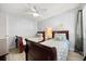 Comfortable bedroom with twin beds, ceiling fan, and bright natural light at 3118 Magic Kingdom Ct, Kissimmee, FL 34746