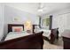 Cozy bedroom featuring two twin beds, ceiling fan, and bright natural light at 3118 Magic Kingdom Ct, Kissimmee, FL 34746