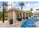 Poolside cabana offering privacy and shade, accompanied by lounge chairs for relaxation and comfort at 3118 Magic Kingdom Ct, Kissimmee, FL 34746