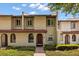 Charming townhome with well-maintained landscaping and a welcoming entrance at 3118 Magic Kingdom Ct, Kissimmee, FL 34746