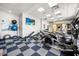 Well-equipped fitness center with modern cardio machines, weights, and ample space for exercise at 3118 Magic Kingdom Ct, Kissimmee, FL 34746