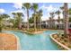 Scenic lazy river with lush landscaping and palm trees providing a relaxing escape at 3118 Magic Kingdom Ct, Kissimmee, FL 34746