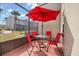 Relaxing patio with seating for four, shielded from the elements by screen at 3118 Magic Kingdom Ct, Kissimmee, FL 34746