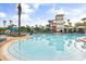 Large pool with wading steps, sun loungers, umbrellas and water slides, perfect for relaxing and recreation at 3118 Magic Kingdom Ct, Kissimmee, FL 34746