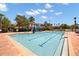 Large community pool with lounge chairs surrounded by lush landscaping at 3118 Magic Kingdom Ct, Kissimmee, FL 34746