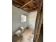 Shows a damaged bathroom with a toilet and exposed wall studs, ready for renovation at 31647 Mount Plymouth Loop, Sorrento, FL 32776