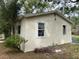 Exterior view of the house showing the stucco and double hung windows at 31647 Mount Plymouth Loop, Sorrento, FL 32776