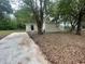 Side view of house featuring small stairs to the front door at 31647 Mount Plymouth Loop, Sorrento, FL 32776