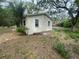 Side view of home featuring large yard and mature trees at 31647 Mount Plymouth Loop, Sorrento, FL 32776