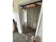 Features a hallway with white walls and flooring, including access to other rooms at 31647 Mount Plymouth Loop, Sorrento, FL 32776