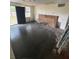 Living room interior needing renovation, with exposed beams and potential for restoration at 31647 Mount Plymouth Loop, Sorrento, FL 32776