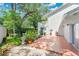 Backyard with large patio, stone accents, landscaping and exterior access to the second story balcony at 3332 Stonewood Ct, Orlando, FL 32806