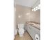 Clean bathroom features a toilet, sink, mirror, and shower curtain at 3332 Stonewood Ct, Orlando, FL 32806