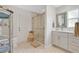 Modern bathroom with walk-in shower, vanity with storage, and stylish mirror at 3332 Stonewood Ct, Orlando, FL 32806