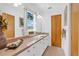 Bright bathroom with long vanity, mirror and tan countertops at 3332 Stonewood Ct, Orlando, FL 32806