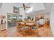 Well-lit dining room with tile floors, leading into the open living area with sliding glass door access at 3332 Stonewood Ct, Orlando, FL 32806