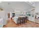 Spacious kitchen featuring a central island with seating, terracotta floors and stainless appliances at 3332 Stonewood Ct, Orlando, FL 32806