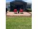Backyard patio with brick pavers and outdoor seating, ideal for relaxation and enjoyment at 3998 Bedford Ave, Winter Haven, FL 33884