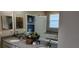 Bathroom features dual sinks, granite countertop, and a separate bathtub at 3998 Bedford Ave, Winter Haven, FL 33884