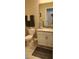 Well-maintained bathroom featuring a toilet and vanity with a modern faucet at 3998 Bedford Ave, Winter Haven, FL 33884