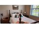 Inviting bedroom with a decorative lamp, a cozy atmosphere, and lots of natural light at 3998 Bedford Ave, Winter Haven, FL 33884