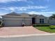 Charming single-story home featuring a brick driveway and a well-manicured lawn at 3998 Bedford Ave, Winter Haven, FL 33884