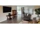 Open-concept living area with wood-look floors connecting living room to kitchen at 3998 Bedford Ave, Winter Haven, FL 33884