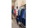 Well-organized walk-in closet with ample storage for clothes and accessories at 3998 Bedford Ave, Winter Haven, FL 33884
