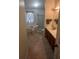 Bathroom with a soaking tub by the window, double sinks with vanities, and a standing shower at 4012 King Edward Dr, Orlando, FL 32826