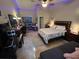 Spacious bedroom with tiled floors, a ceiling fan, and a comfortable queen size bed and a futon for guests at 4012 King Edward Dr, Orlando, FL 32826