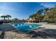 Beautiful community pool with plenty of lounge chairs and palm trees, perfect for relaxing and enjoying the sun at 4012 King Edward Dr, Orlando, FL 32826