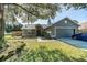 Charming single-Gathering home showcasing well-maintained landscaping and a two-car garage at 4012 King Edward Dr, Orlando, FL 32826