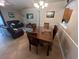 Spacious open-concept living and dining area with sliding doors leading to the outside at 4012 King Edward Dr, Orlando, FL 32826