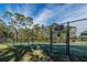 A well-maintained community tennis court, fully enclosed with fencing for your enjoyment and sport activities at 4012 King Edward Dr, Orlando, FL 32826