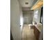 Cozy bathroom featuring a glass shower, tiled floors, and natural light at 403 Short Dr, Poinciana, FL 34759