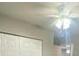 Bright bedroom featuring a ceiling fan and neutral walls at 403 Short Dr, Poinciana, FL 34759