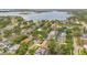 Aerial view showcasing waterfront neighborhood, lake views, and lush greenery at 4119 Pecan Ln, Orlando, FL 32812