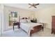 Inviting bedroom with window and classic wooden bedframe at 4119 Pecan Ln, Orlando, FL 32812