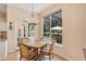 Cozy dining area with a backyard view, a chandelier, and access to a patio at 4119 Pecan Ln, Orlando, FL 32812