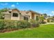 Beautiful home showcasing lush landscaping, mature trees, and manicured lawn on a sunny day at 4119 Pecan Ln, Orlando, FL 32812