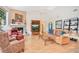 Cozy living room with a stone fireplace, vaulted ceilings, and hardwood floors at 4119 Pecan Ln, Orlando, FL 32812