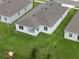 Aerial view of the home showcasing the spacious backyard and the neighborhood surroundings at 451 Shadow Gorge Way, Eustis, FL 32736
