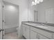 Bathroom featuring double sinks, granite countertops, and tiled shower/tub at 451 Shadow Gorge Way, Eustis, FL 32736