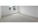 Clean bedroom with carpet flooring and bright light at 451 Shadow Gorge Way, Eustis, FL 32736