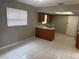 This small kitchen has wood cabinets, tile flooring and a skylight to let natural light in at 4617 Frisco Cir, Orlando, FL 32808