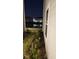 Exterior backyard featuring a pond view, manicured landscaping, and serene outdoor setting at 4762 Sparkling Shell Ave, Kissimmee, FL 34746